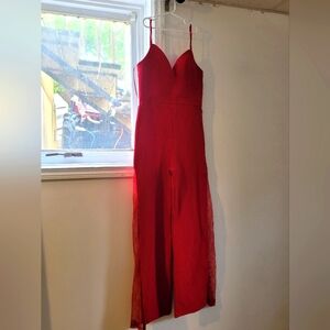 Red jumpsuit/romber with lace cutouts